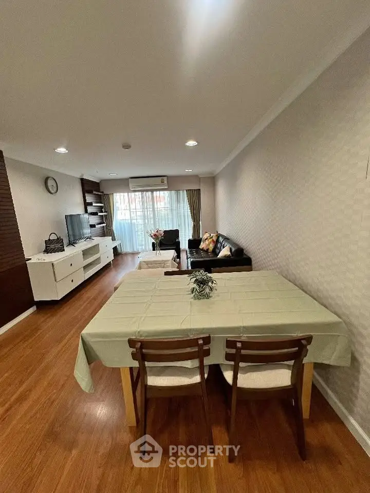Spacious living room with elegant dining area and modern decor