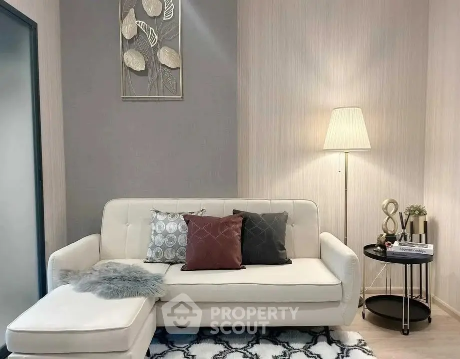 Stylish modern living room with elegant decor and cozy seating area.