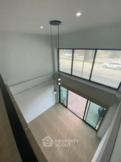 Spacious modern loft with large windows and high ceiling