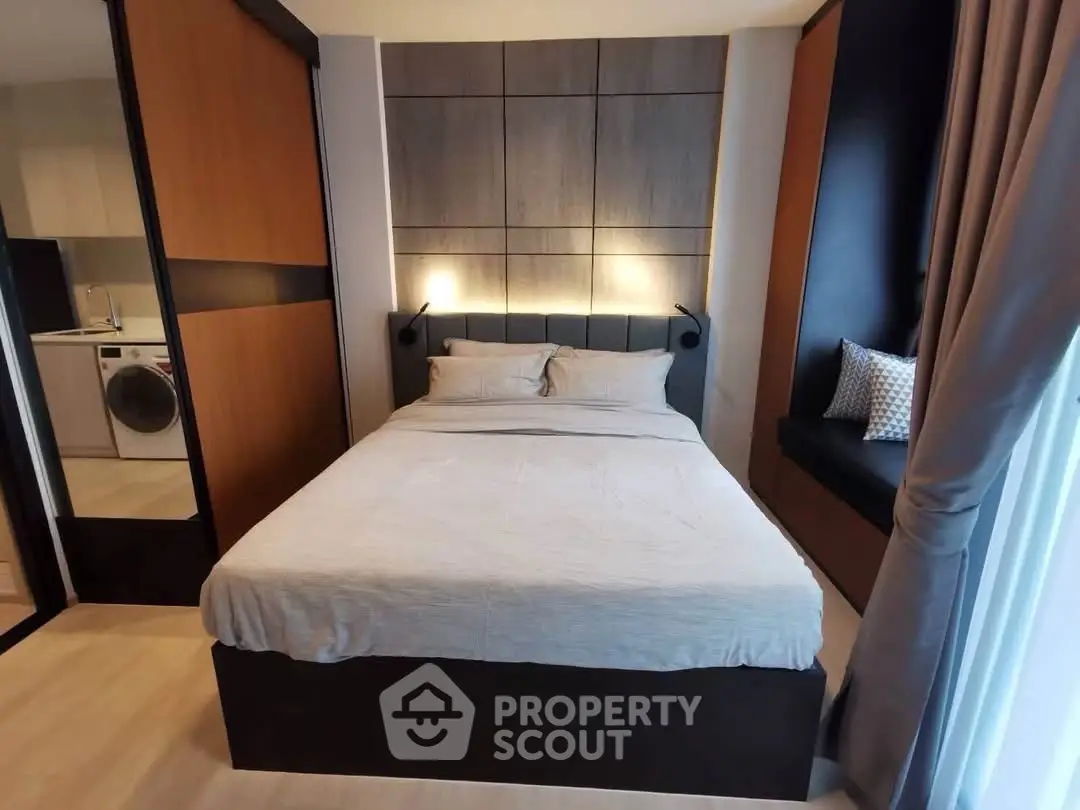 Modern bedroom with cozy bed and stylish decor in a contemporary apartment.