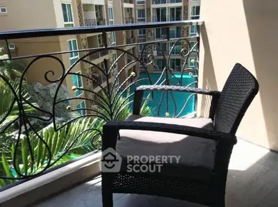 Charming balcony with pool view in a modern apartment complex, perfect for relaxation and leisure.