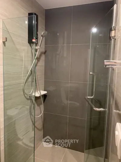 Modern bathroom with sleek glass shower and contemporary tiles