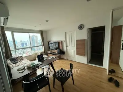 Modern living room with city view, wooden flooring, and stylish furniture in a high-rise apartment.