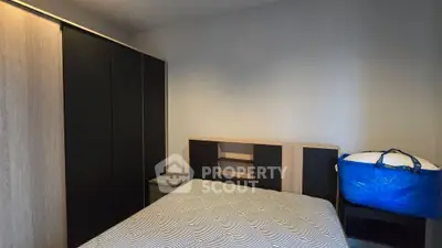 Cozy bedroom with modern wardrobe and stylish decor