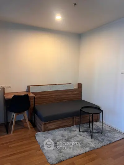 Cozy bedroom with modern furniture and soft lighting, perfect for relaxation and comfort.