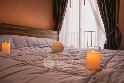 Cozy bedroom with soft lighting and elegant curtains, perfect for relaxation.