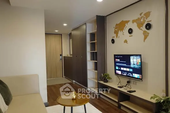 Modern living room with wall-mounted TV and stylish decor