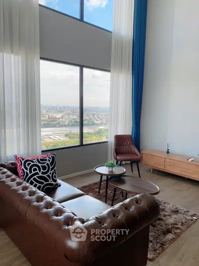 Luxurious living room with stunning city view and elegant leather sofa
