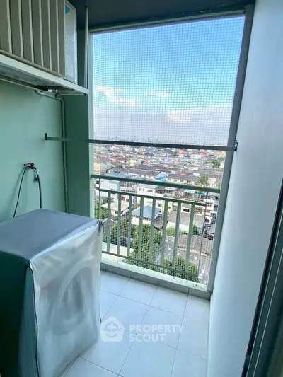 High-rise balcony with city view and washing machine setup