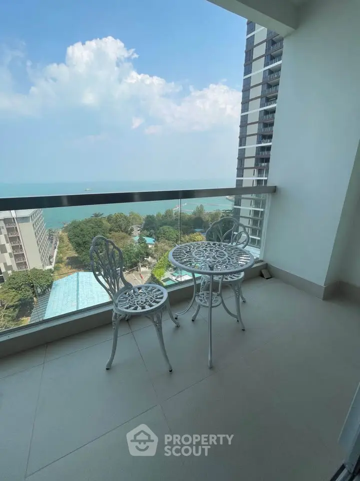 Stunning balcony with ocean view in modern high-rise apartment