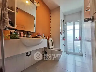 Modern bathroom with sleek fixtures and ample natural light