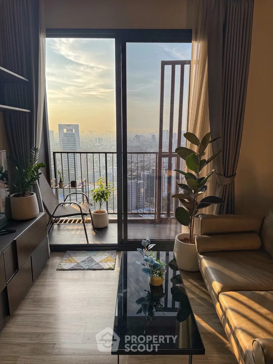 Modern living room with stunning city view and cozy decor