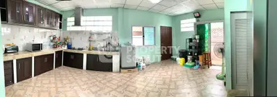 Spacious kitchen with modern appliances and ample storage in a bright, airy home.