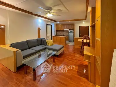 Spacious living room with modern furniture and open kitchen layout