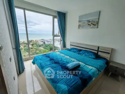 Stunning bedroom with panoramic ocean view and modern decor