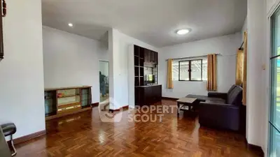 Spacious living room with wooden flooring and modern furniture