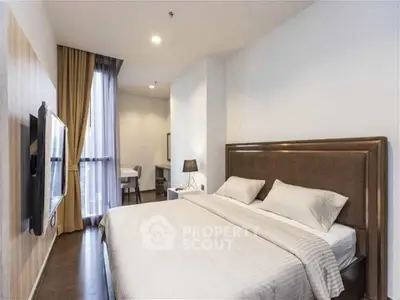 Spacious modern bedroom with elegant decor and natural light