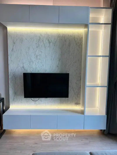 Modern living room with sleek TV unit and ambient lighting