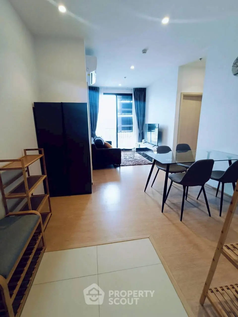 Modern living room with dining area and large window view