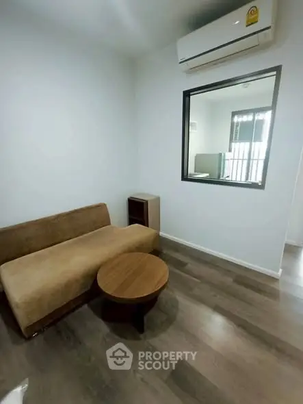 Modern living room with sleek air conditioning and minimalist furniture