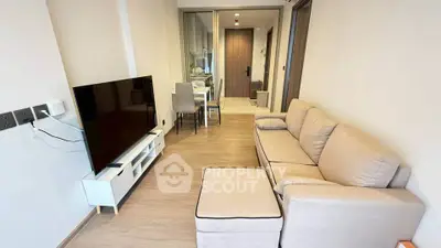 Modern living room with cozy sofa and large TV in stylish apartment