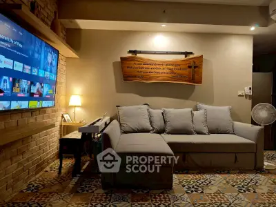 Cozy living room with stylish decor and modern entertainment setup
