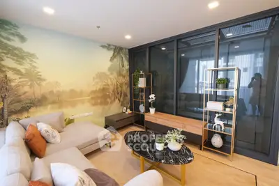 Luxurious living room with elegant decor and scenic wall mural, perfect for relaxation and entertainment.