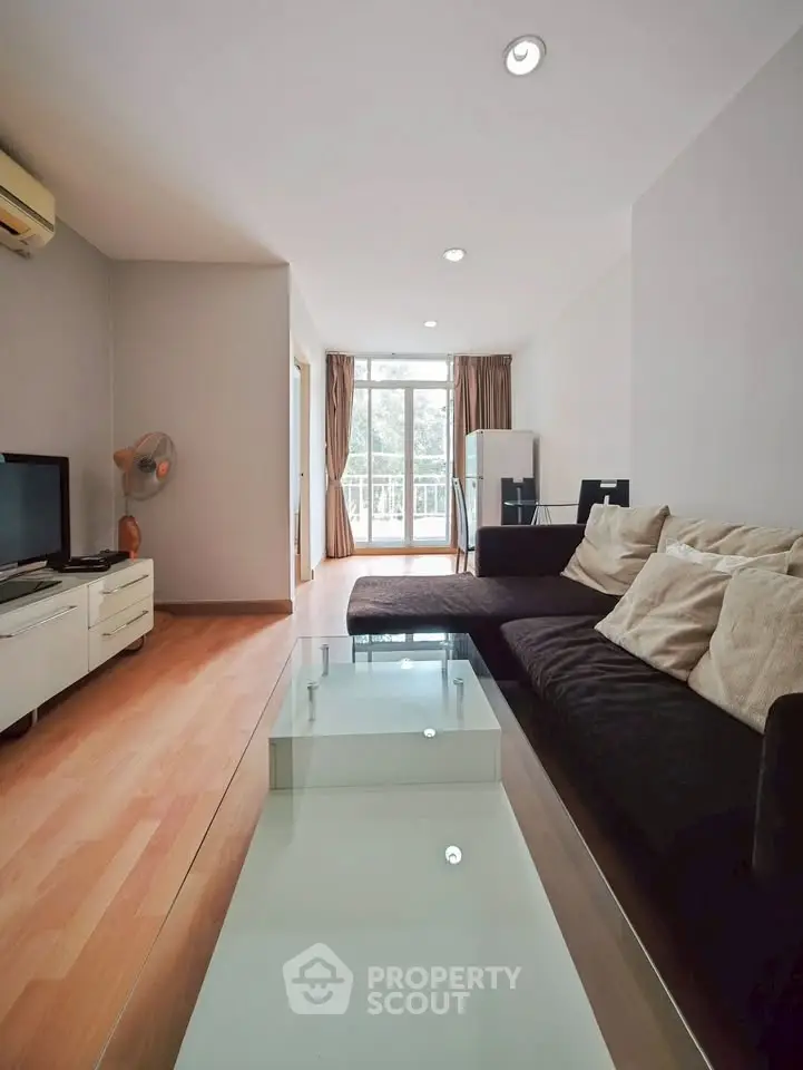 Spacious living room with modern decor and natural light