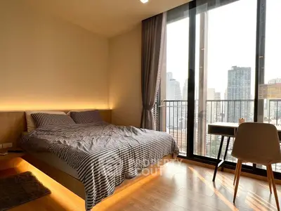 Modern bedroom with city view and stylish decor in high-rise apartment