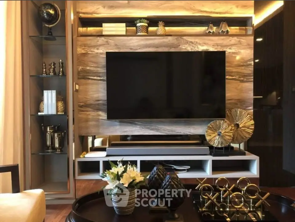 Luxurious living room with modern TV setup and elegant decor accents
