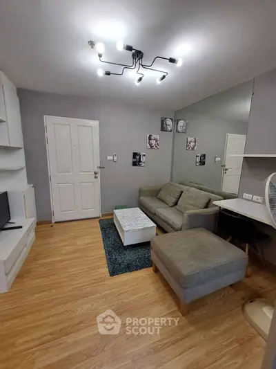 Modern living room with stylish lighting and cozy furniture