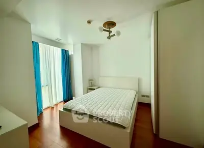 Spacious modern bedroom with natural light and elegant decor