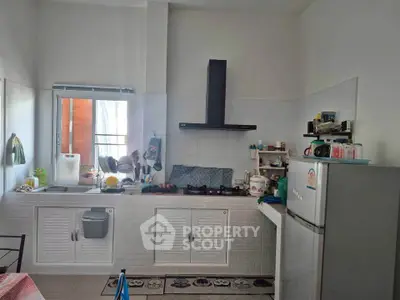 Charming kitchen with modern appliances and sleek design, perfect for culinary enthusiasts.