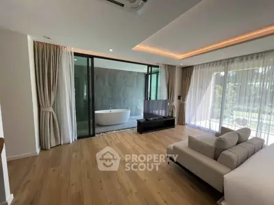 Luxurious living room with open view to modern bathroom and elegant decor