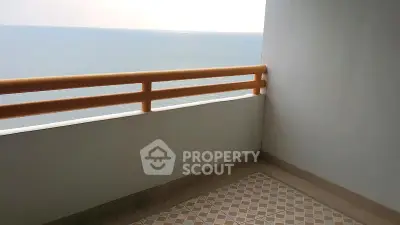 Stunning ocean view from a spacious balcony with elegant railing and tiled floor.