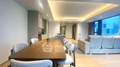 Luxurious open-plan living and dining area with modern furnishings and city view.