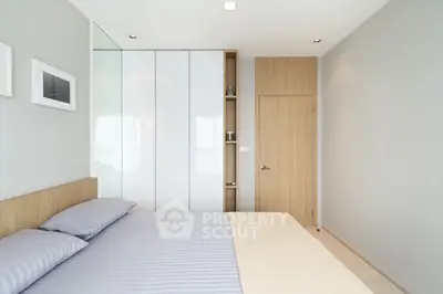 Modern bedroom with minimalist design and ample natural light