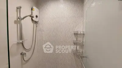 Modern bathroom with sleek shower and elegant tile design