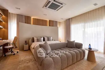 Luxurious bedroom with modern decor and large windows for natural light