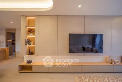 Modern living room with sleek built-in TV unit and ambient lighting