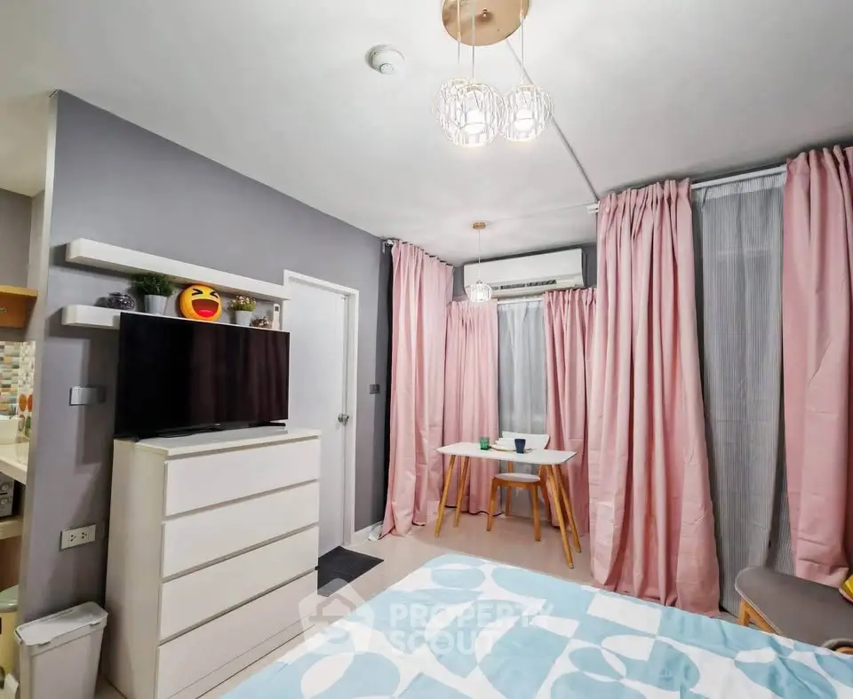 Charming bedroom with modern decor, featuring a cozy dining nook and stylish lighting.