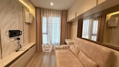 Modern living room with elegant sofa and large window in a stylish apartment.