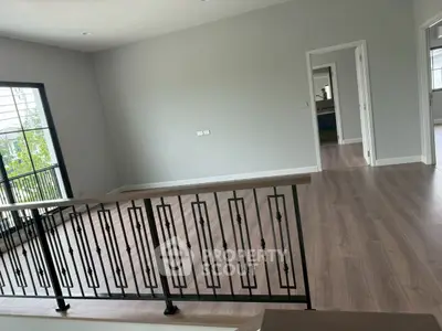 Spacious modern interior with elegant railing and open layout