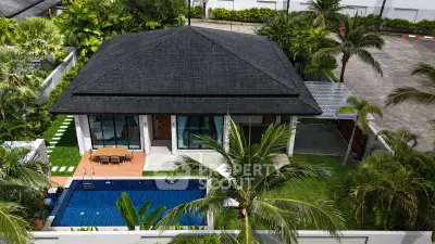 Luxurious villa with private pool and lush garden, perfect for tropical living.
