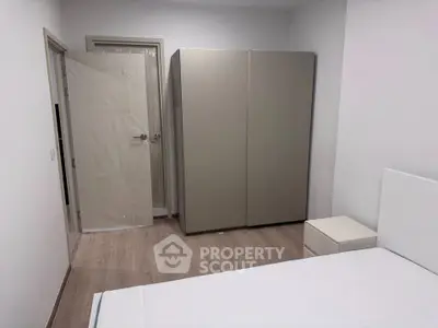 Minimalist bedroom with modern wardrobe and sleek design