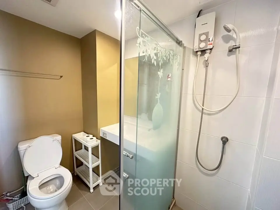 Modern bathroom with glass shower and sleek fixtures