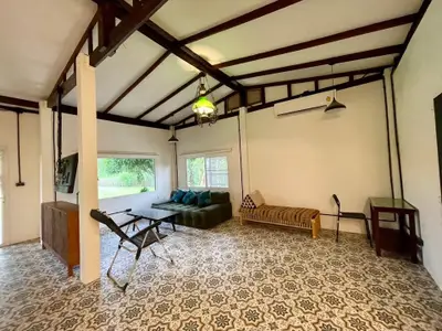 Spacious living room with vintage tiles and modern decor in a cozy home.