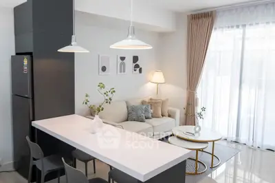 Modern living room with sleek design, open layout, and natural light