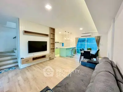 Spacious modern living room with open kitchen and stylish decor