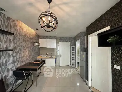Modern kitchen and dining area with stylish lighting and sleek design